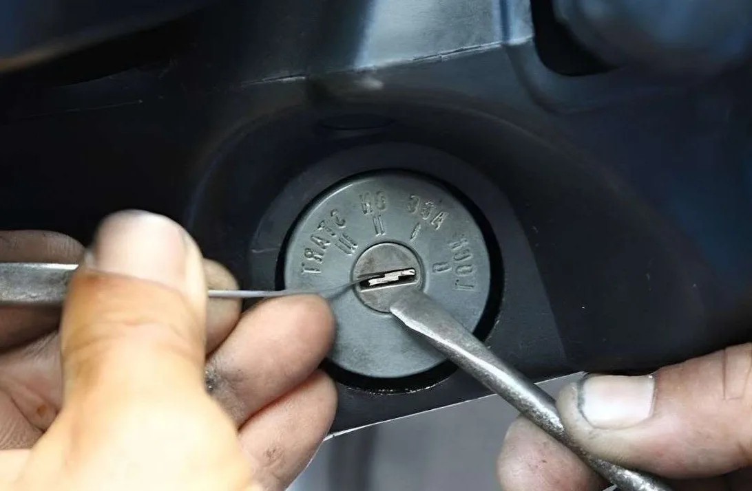 Broken car key extraction from door lock using professional extractor tools by Triton Locksmith
