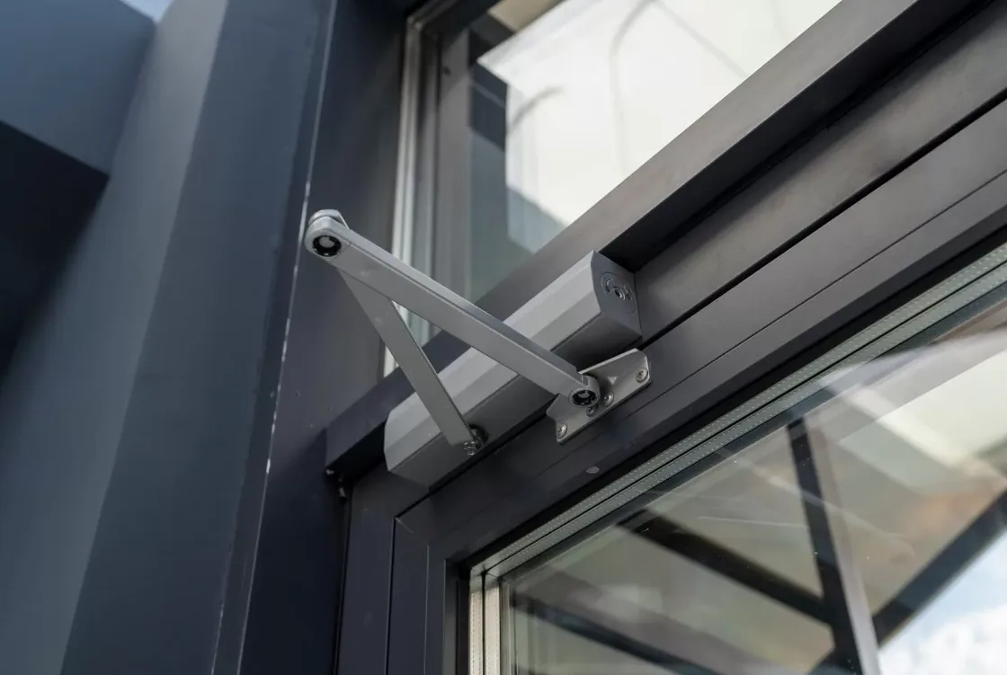 Commercial door closer repair by Triton Locksmith on office building door