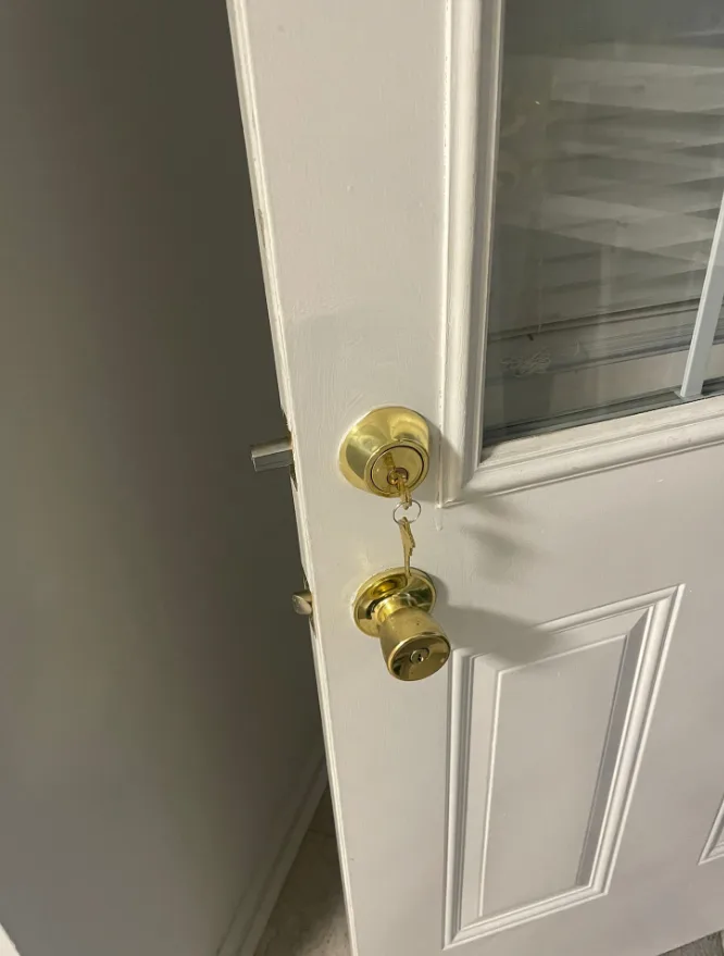 Deadbolt lock installation on garage entry door leading into house for security