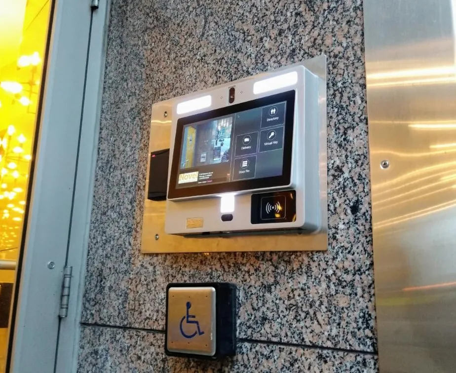 Triton Locksmith installing intercom with electric strike door release at South Florida office