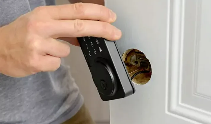 Keypad lock installation on residential front door for keyless entry by Triton Locksmith