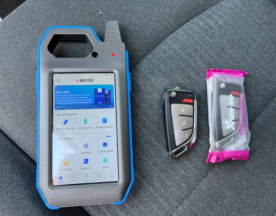 Key fob programming using OBD-II diagnostic tool to register new fob to vehicle computer