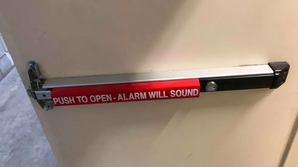 Von Duprin panic bar exit device installed on commercial fire door