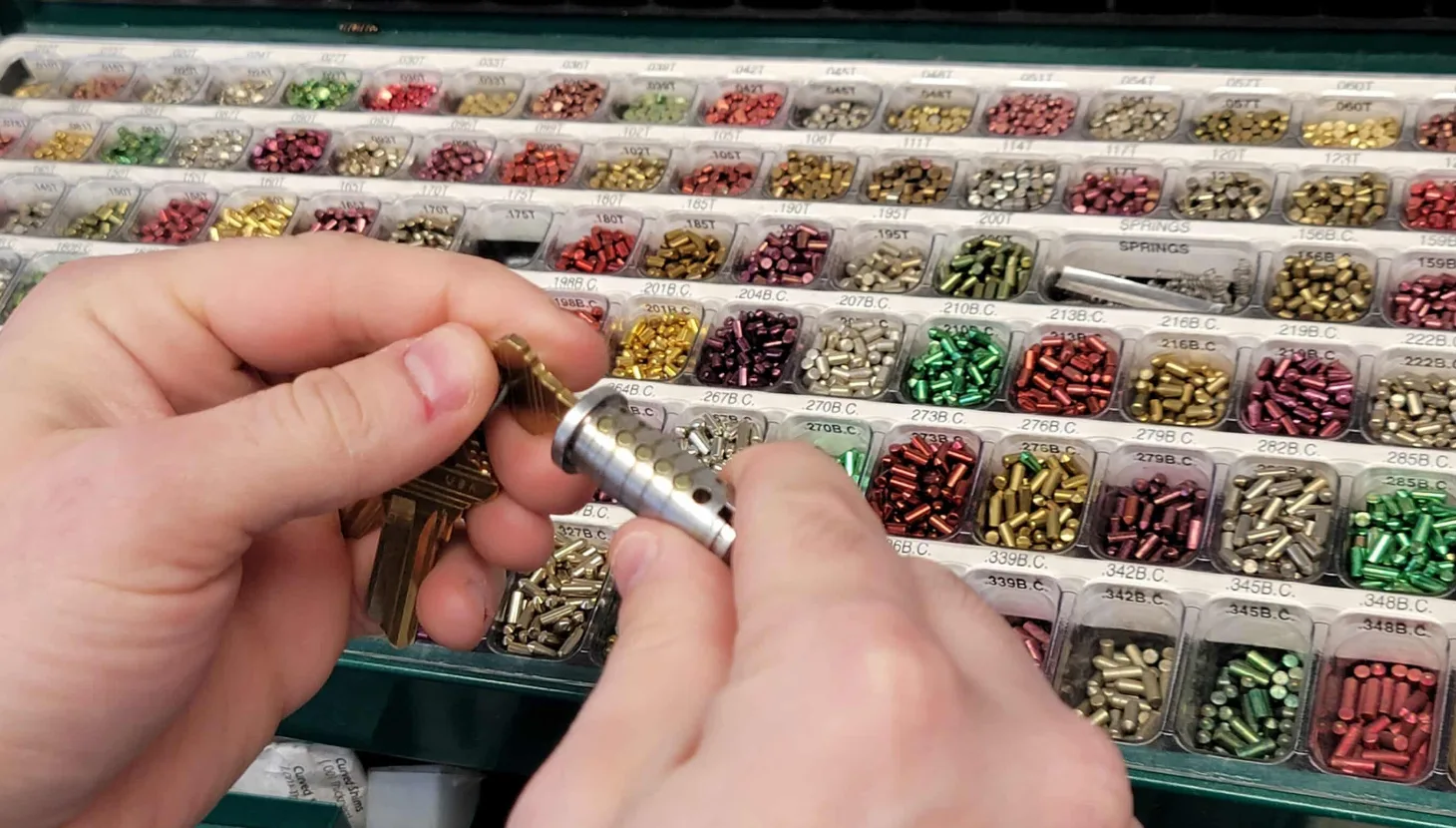 Locksmith rekeying residential door lock cylinder at home in South Florida