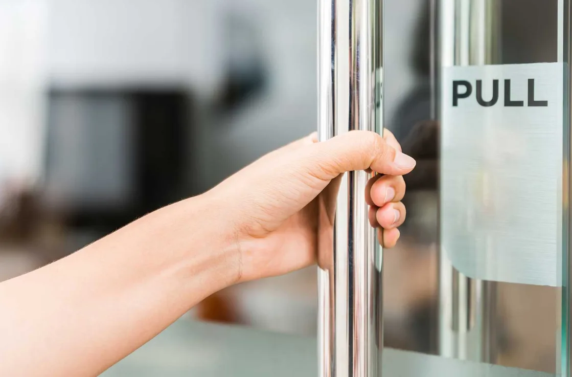 Adams Rite storefront lock installation on aluminum frame glass door by Triton Locksmith