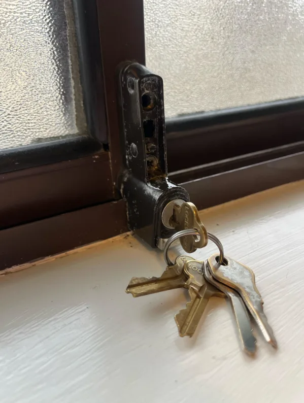 Window lock repair and replacement on double-hung window in South Florida home